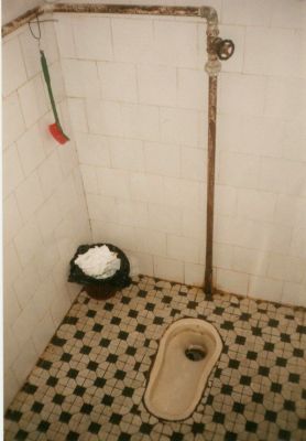 Squat toilet in Xingping, in Guangxi Provence, southeastern China.