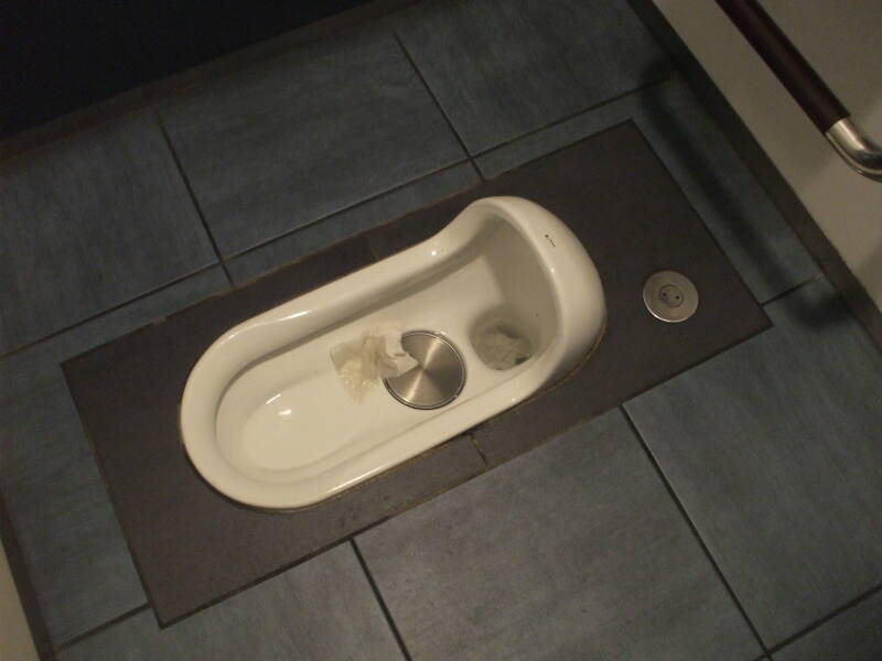 Squat toilet, at Haneda Airport in Tokyo.