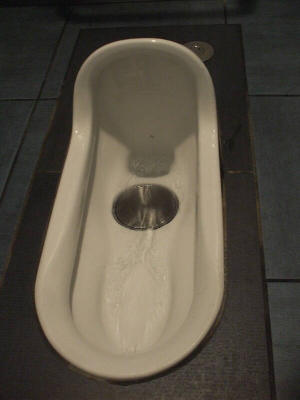 Squat toilet, at Haneda Airport in Tokyo.