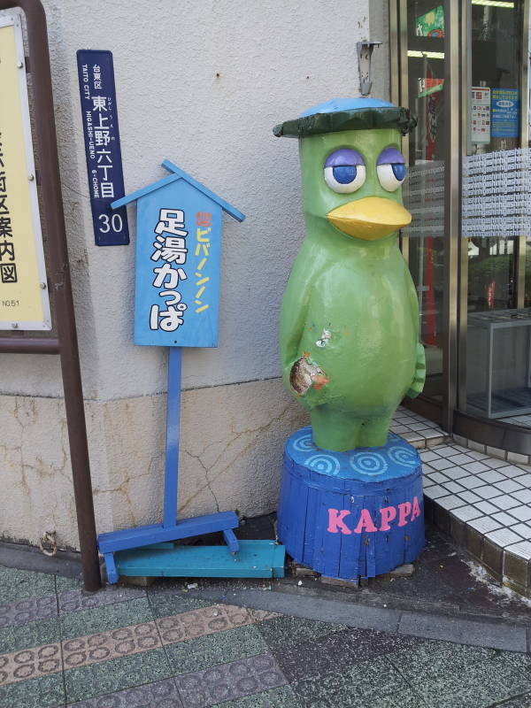 Kappa statue outside a kitchen supply store in Kappabashi-dori or Kitchen Town district of Tokyo.