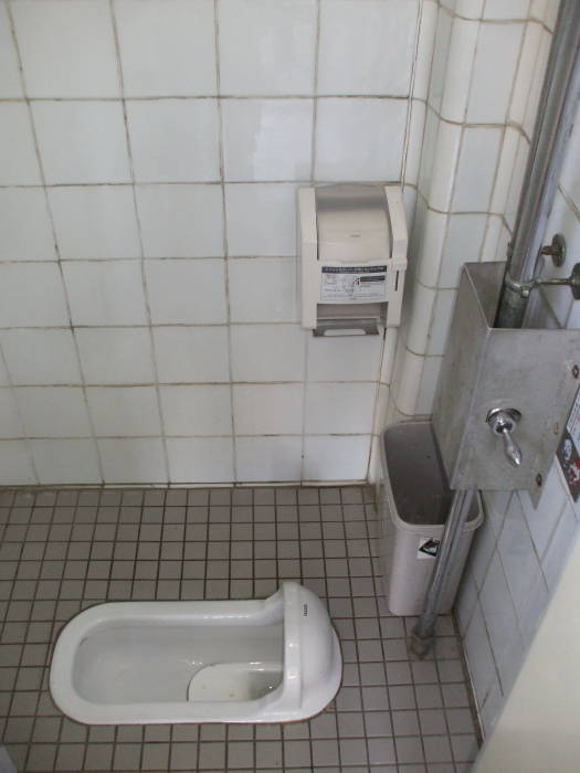 Squat toilet along Takase Canal in Kyōto.