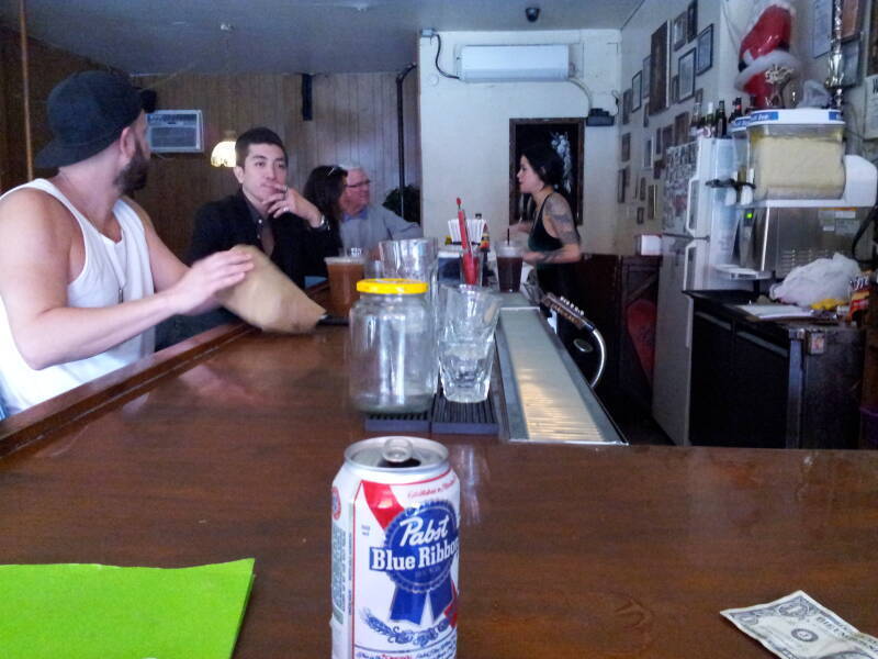 Bartender and mid-day patrons at Welcome To The Johnson's Bar on Rivington Street on the Lower East Side in New York.