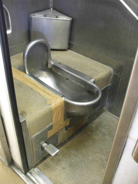 Japanese stainless steel squat train toilet on board the Tobu Railway from Nikko to Minami-Kurihashi.