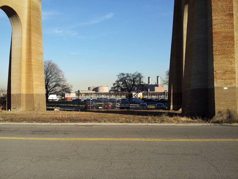 Wards Island Wastewater Treatment Plant seen underneath the Hell Gate railway bridge.