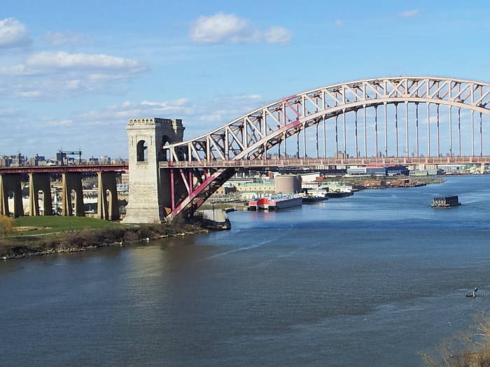 Wards Island Waste Water Treatment Plant visible undernear the Hell Gate railway bridge.