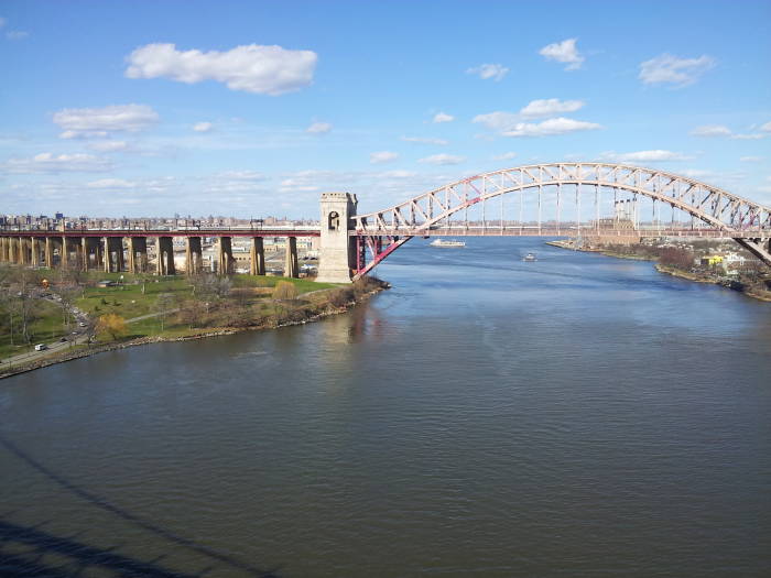 Wards Island Waste Water Treatment Plant visible undernear the Hell Gate railway bridge.