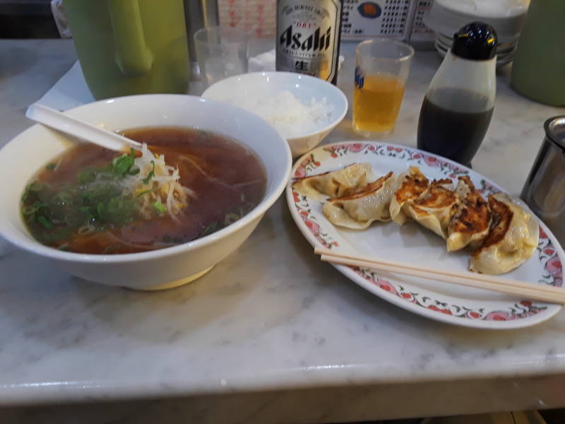 Getting lunch a noodle shop in Osaka: gyoza, ramen, and biru.