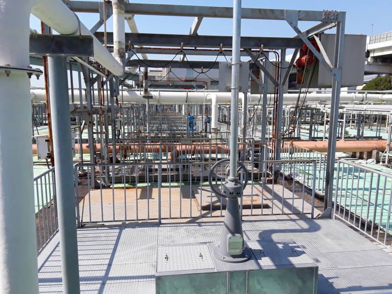 Covered sedimentation and aeration tanks and overhead pipes at the Ebie Sewage Treatment Plant in Osaka.