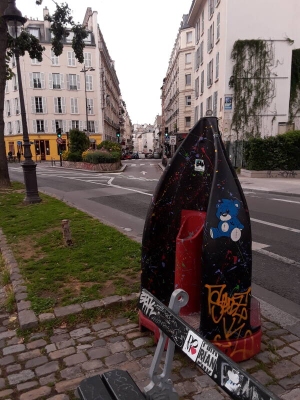 A colorful portable pissoir along the Canal Saint Martin in Paris.