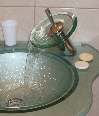 Very nice glass sink with 'bowl' style faucet.
