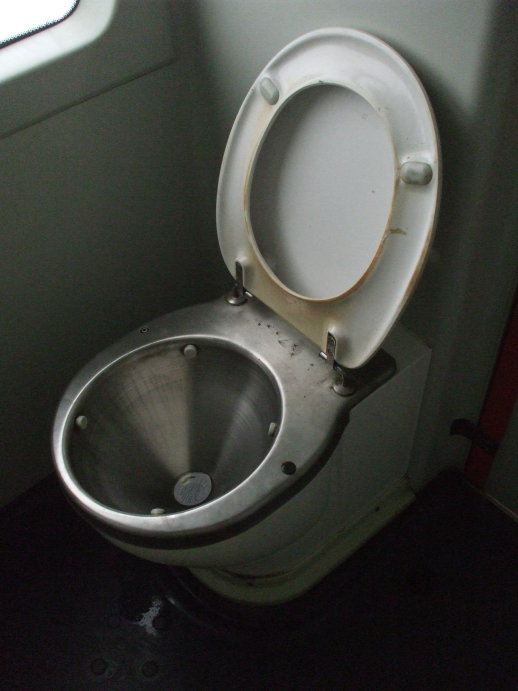 Stainless steel toilet on board a Romanian train from Bucharest to Suceava.