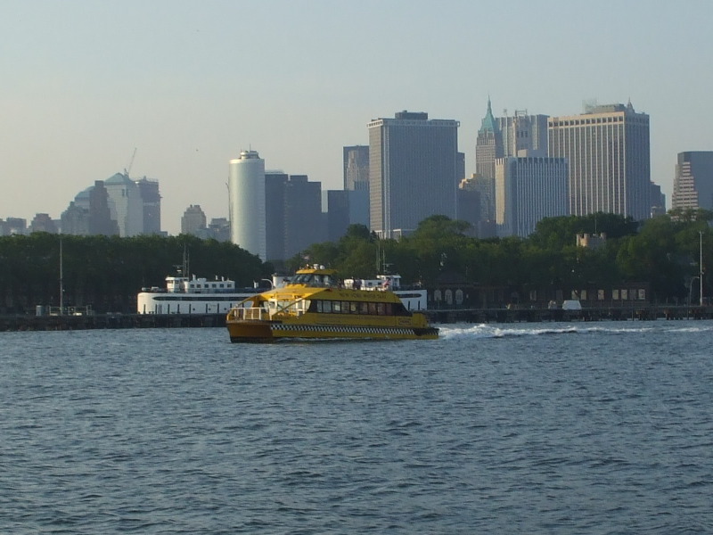 NY Water Taxi crossing New York Harbor between Governor's Island and Brooklyn.