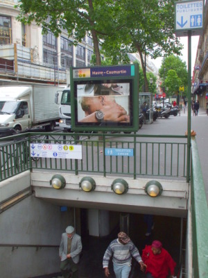 Toilet signs at a Paris Metro station.