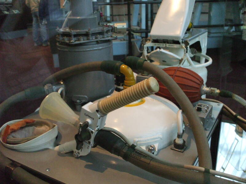 Soviet or Russian Soyuz spacecraft toilet configured for male use.