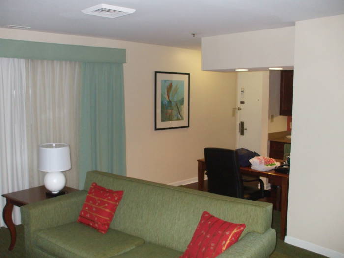 Hotel suite: dining area and sofa.