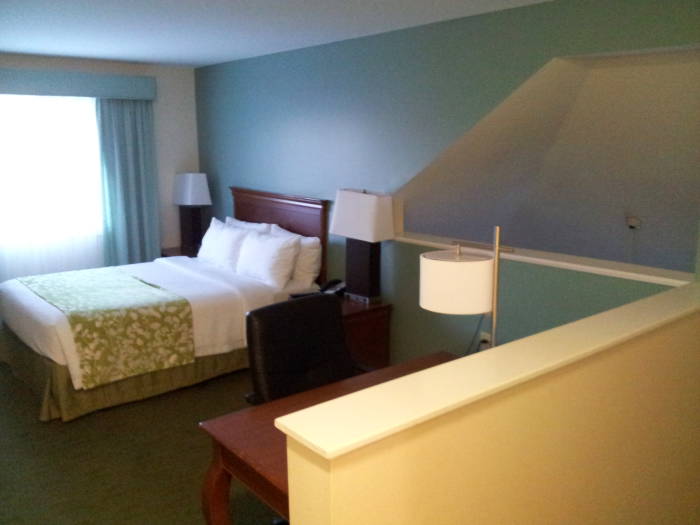 Hotel suite: bed and table.