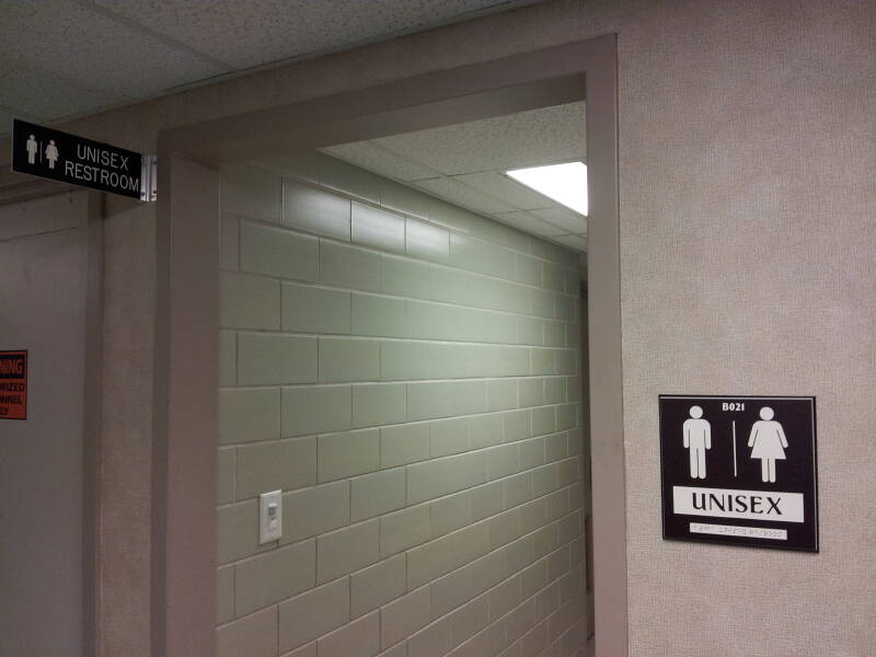 Signs and entry to unisex restroom at Purdue University.