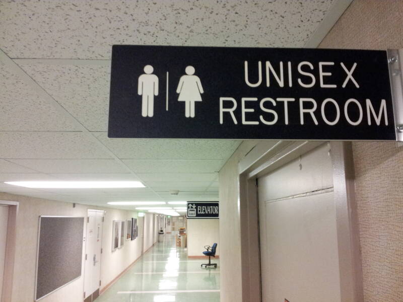 Signs and entry to unisex restroom at Purdue University.