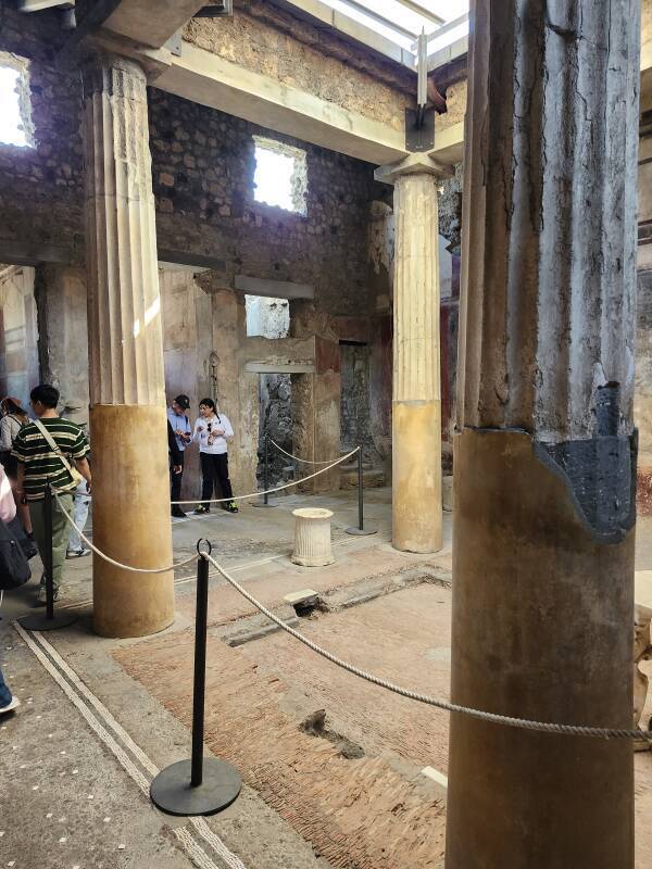 Atrium and Impluvium at Casa dei Ceii, with the door into the latrine beside the entryway.