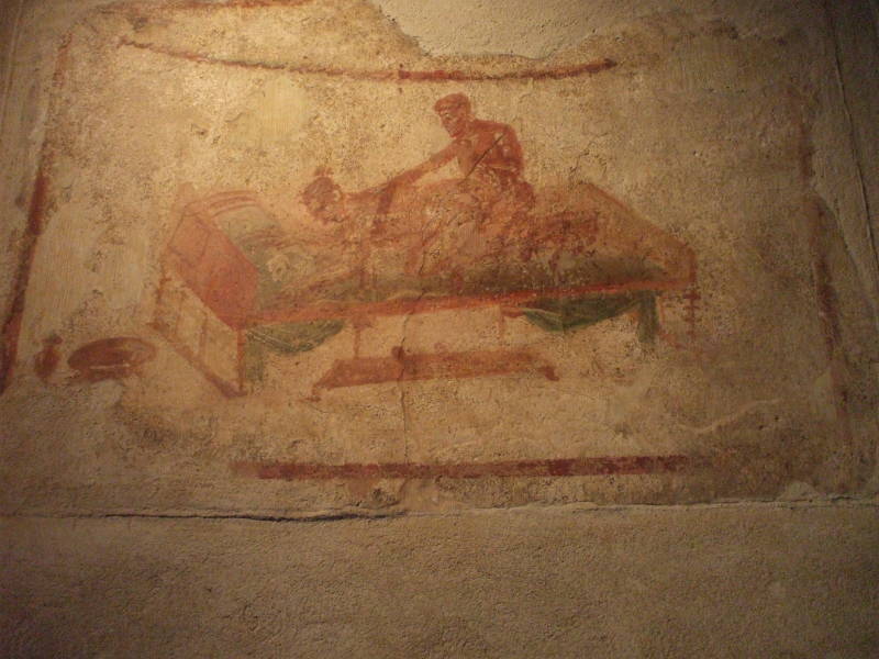 Erotic fresco in the Lupanaro, a Roman brothel at Pompeii.