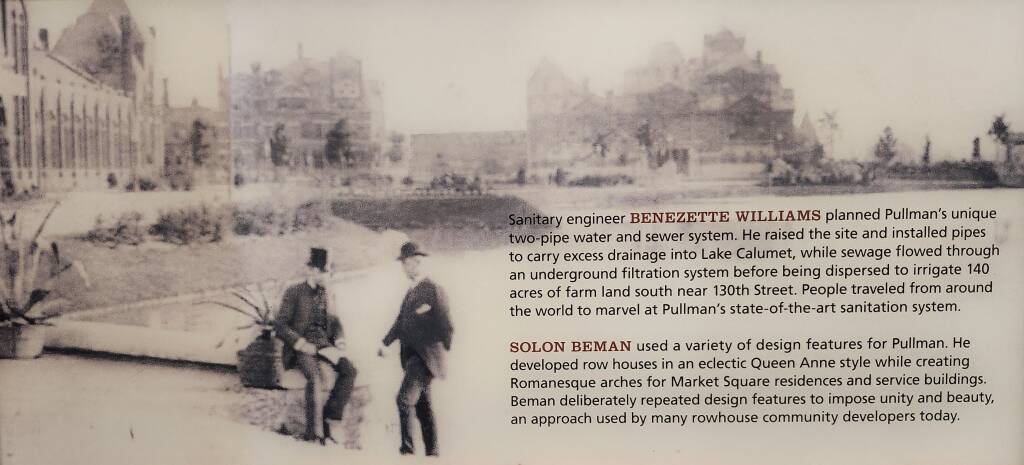 Photo during construction showing two men formally dressed.