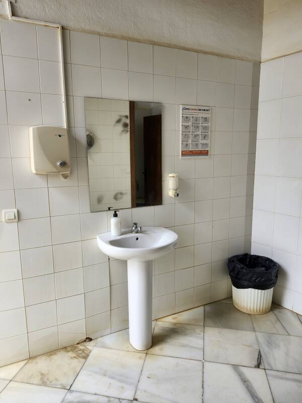 Sink and mirror in the restroom.