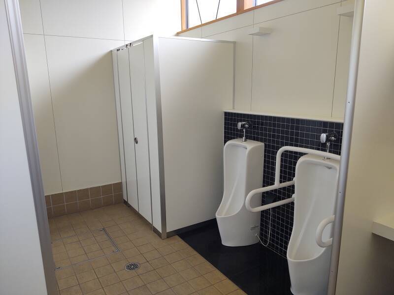 Urinals and toilet stalls in the public lavatory within the Yamagata Castle walls.