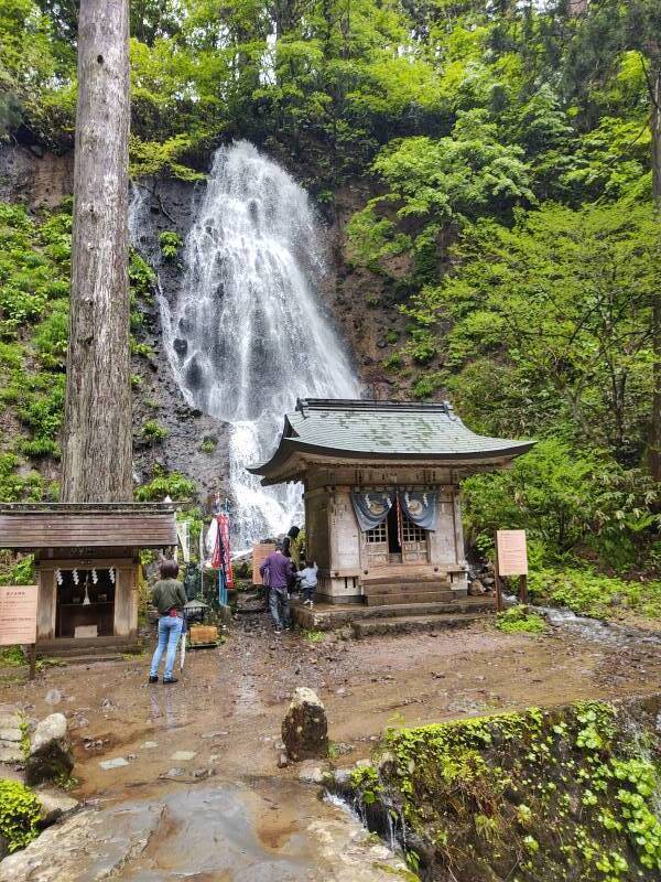 Shintō shrine with Buddhist elements beside a waterfall near the entrance to the Mount Haguro trail.