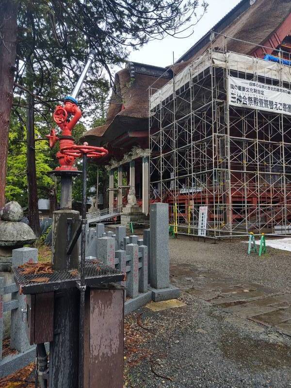 Water cannon aimed at Sanzan Gosai-den, the main temple/shrine at the summit of Mount Haguro.