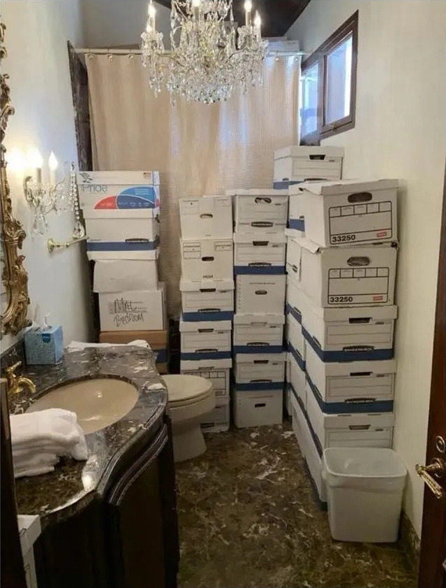 Stacks of boxes filled with classified documents, stolen by Donald Trump and stored in a terribly tacky bathroom.