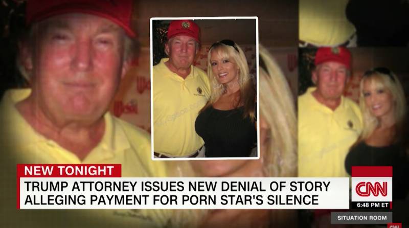 Donald Trump with a pornographic performer he tried to quiet with hush money, and denied their affair.